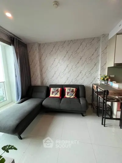 Modern living room with stylish sofa and marble accent wall