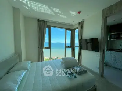 Luxurious bedroom with stunning ocean view and modern amenities