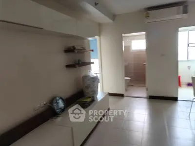 Spacious modern living area with air conditioning and tiled flooring