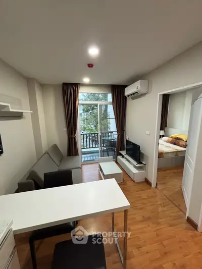 Modern apartment living room with open layout and balcony view