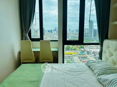 Modern bedroom with stunning city view from large windows, featuring a cozy bed and a study area.