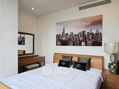 Elegant bedroom with cityscape artwork and wooden furniture