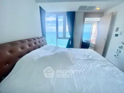 Luxurious bedroom with stunning ocean view and elegant decor