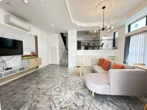 Spacious modern living room with marble flooring and stylish decor