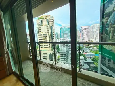 Spacious balcony with stunning city skyline view in modern high-rise apartment.