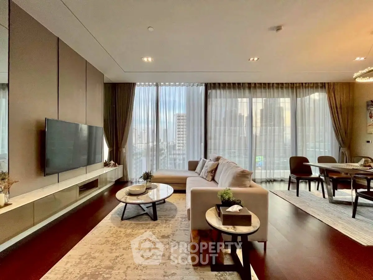 Luxurious modern living room with elegant decor and city view, featuring a spacious open layout and stylish furniture.