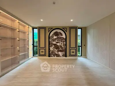 Spacious modern living room with elegant wall art and ample natural light