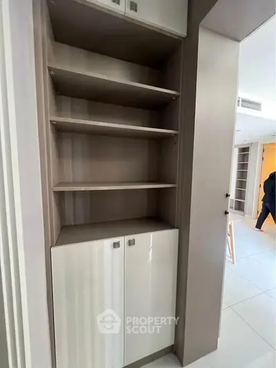 Modern built-in storage unit with sleek design and ample shelving space.