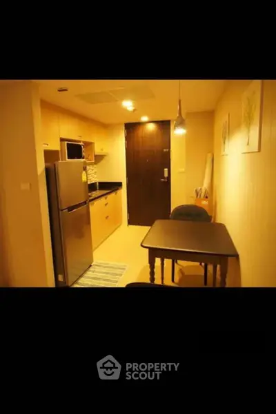 Cozy kitchen with dining area and modern appliances in compact layout