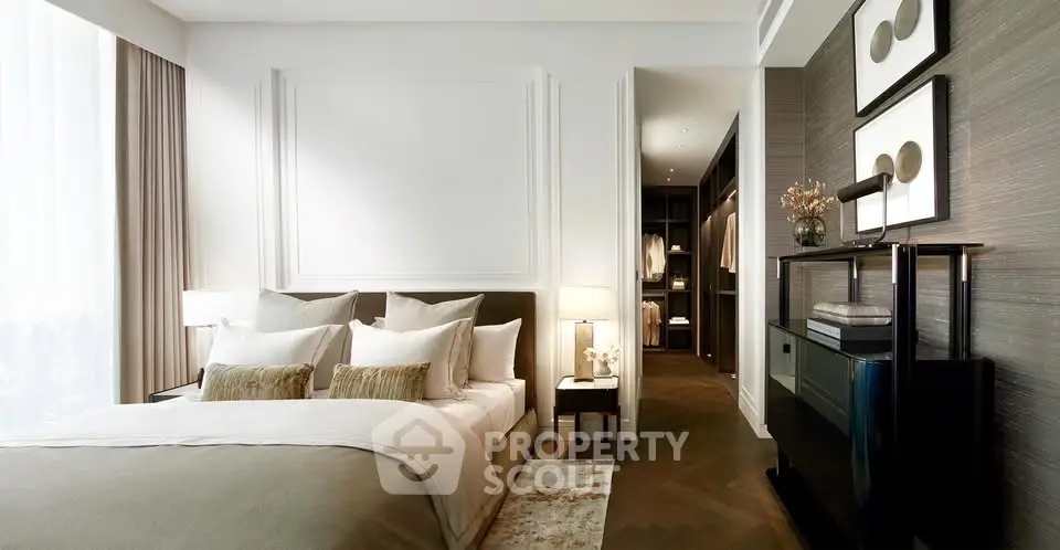 Luxurious modern bedroom with elegant decor and walk-in closet, featuring plush bedding and stylish lighting.