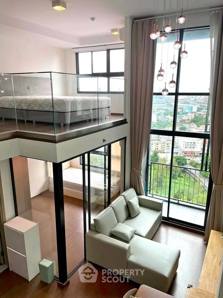 Stunning loft apartment with floor-to-ceiling windows and a mezzanine bedroom offering breathtaking city views.