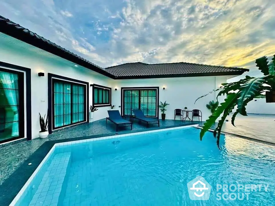 Luxurious villa with private pool and modern design under a stunning sky.