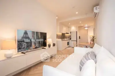 Modern living room with open kitchen layout and stylish decor