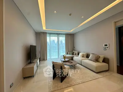Luxurious living room with modern furniture and city view, perfect for relaxation and entertainment.