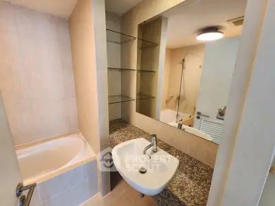 Modern bathroom with bathtub and sleek sink design