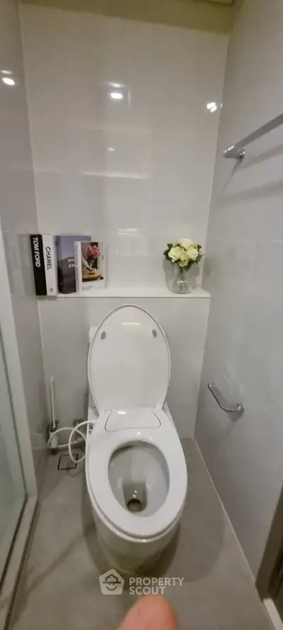 Modern bathroom with sleek toilet and elegant decor