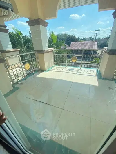 Spacious balcony with scenic view, perfect for relaxation and outdoor enjoyment.