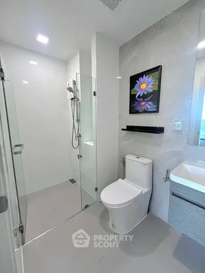 Modern bathroom with sleek design and glass shower enclosure