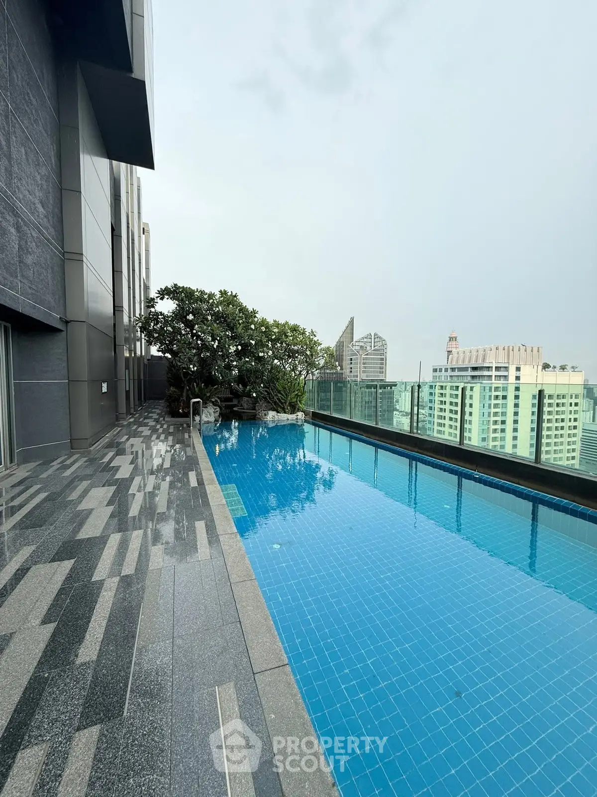 Luxurious rooftop pool with stunning cityscape views and modern design.