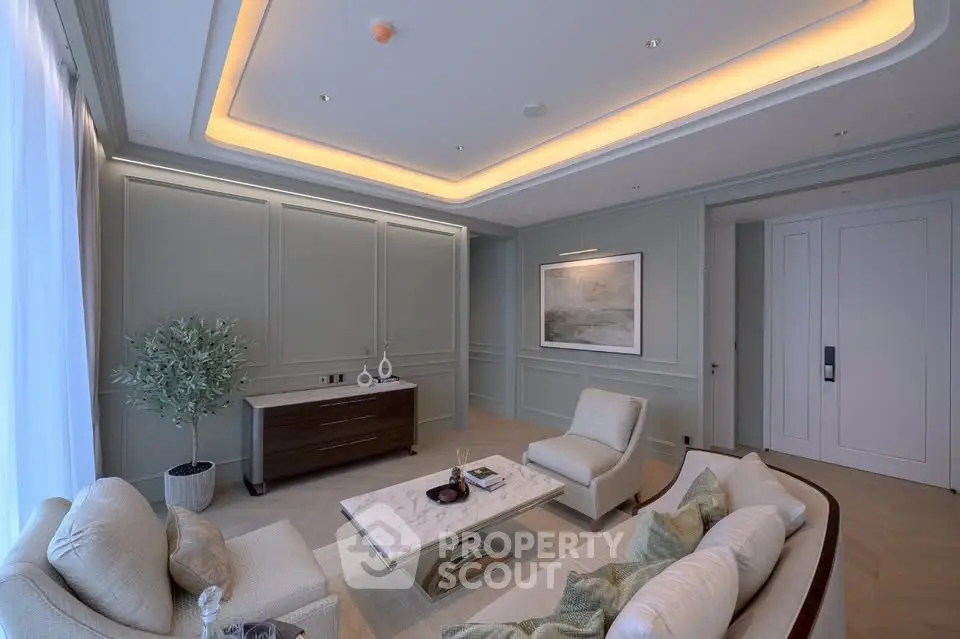 Luxurious living room with elegant decor and ambient lighting, featuring plush seating and a stylish coffee table.