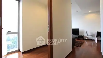 Modern apartment interior with wooden flooring and natural light