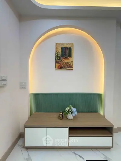 Elegant interior design with modern lighting and stylish decor in a cozy living space.