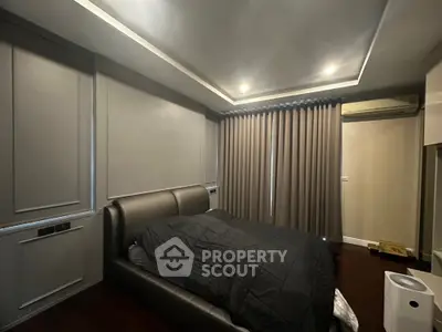 Modern bedroom with sleek design and ambient lighting