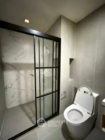 Modern bathroom with sleek shower and contemporary toilet design