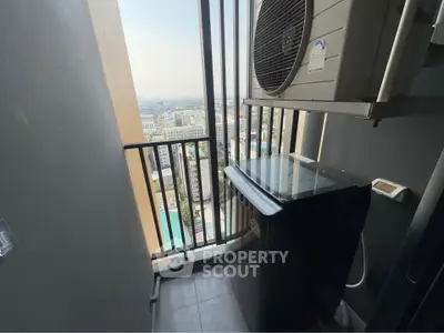 Compact balcony with city view and air conditioning unit in modern apartment