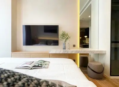 Modern bedroom with sleek TV setup and stylish decor