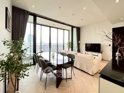 Spacious modern living room with panoramic city view and elegant decor