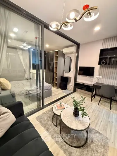 Modern living room with glass partition, stylish decor, and cozy ambiance