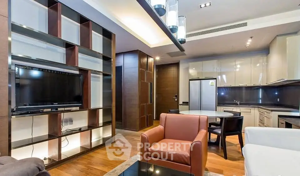 Modern living room with stylish furniture and open kitchen layout