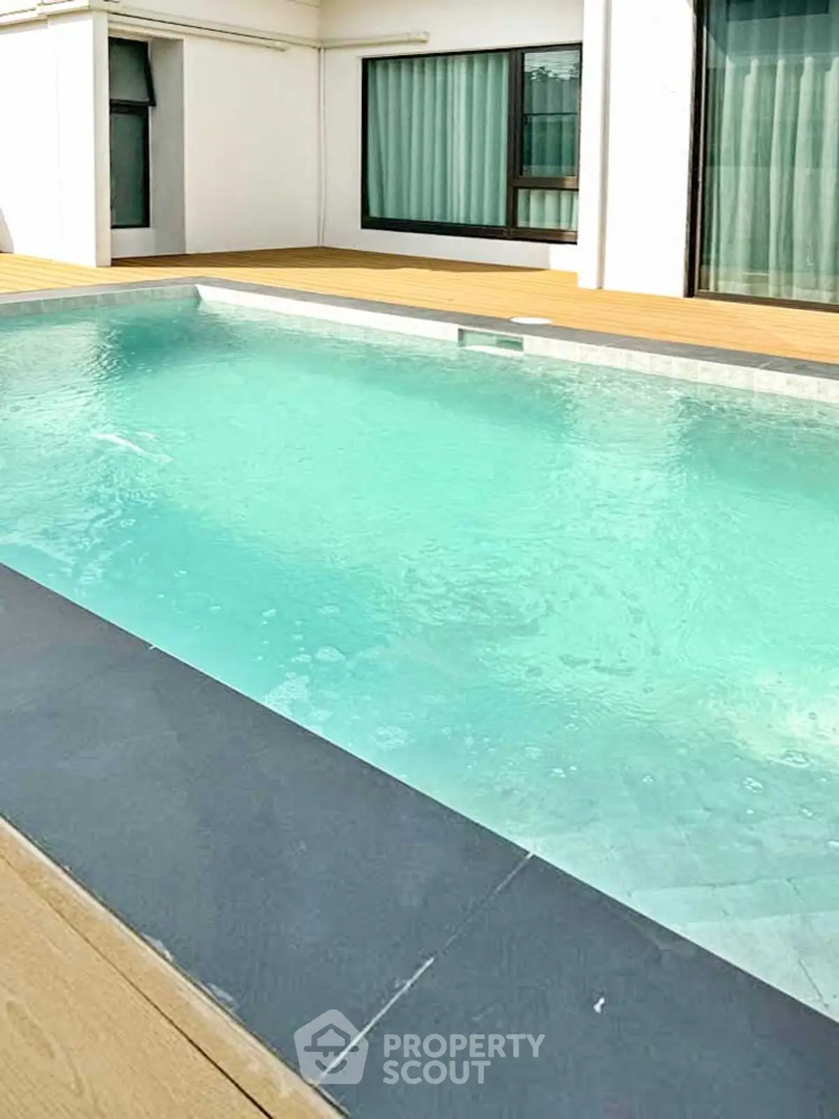 Luxurious private pool with modern design in a serene residential setting.