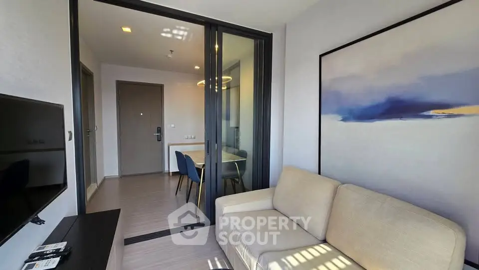 Modern living room with cozy sofa and elegant decor in a stylish apartment.