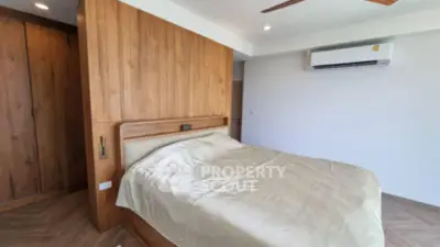 Modern bedroom with wooden accents and air conditioning unit