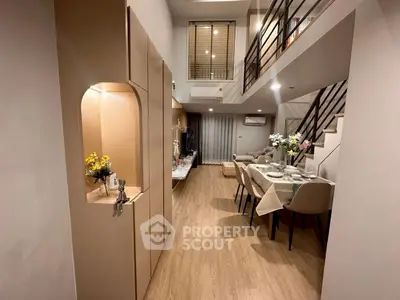Modern duplex living room with elegant dining area and stylish decor