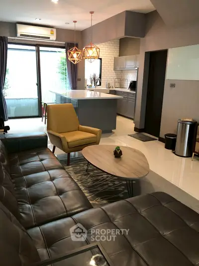 Modern living room with open kitchen and stylish decor