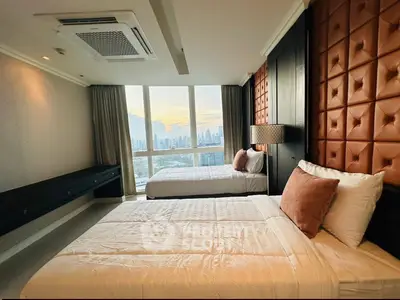 Luxurious bedroom with stunning city view and elegant decor