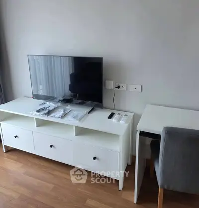 Modern living room with sleek TV unit and cozy study desk