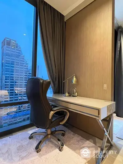 Modern study area with city view, sleek desk, and ergonomic chair in luxury apartment.