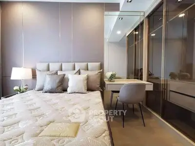 Luxurious bedroom with elegant decor and mirrored wardrobe