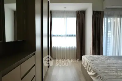 Modern bedroom with natural light and stylish decor