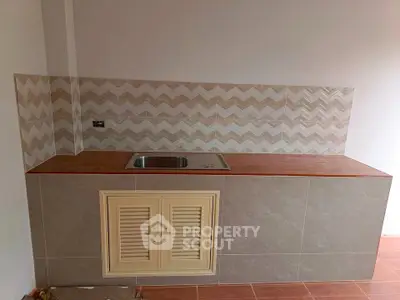 Modern kitchen with stylish backsplash and sleek countertop design