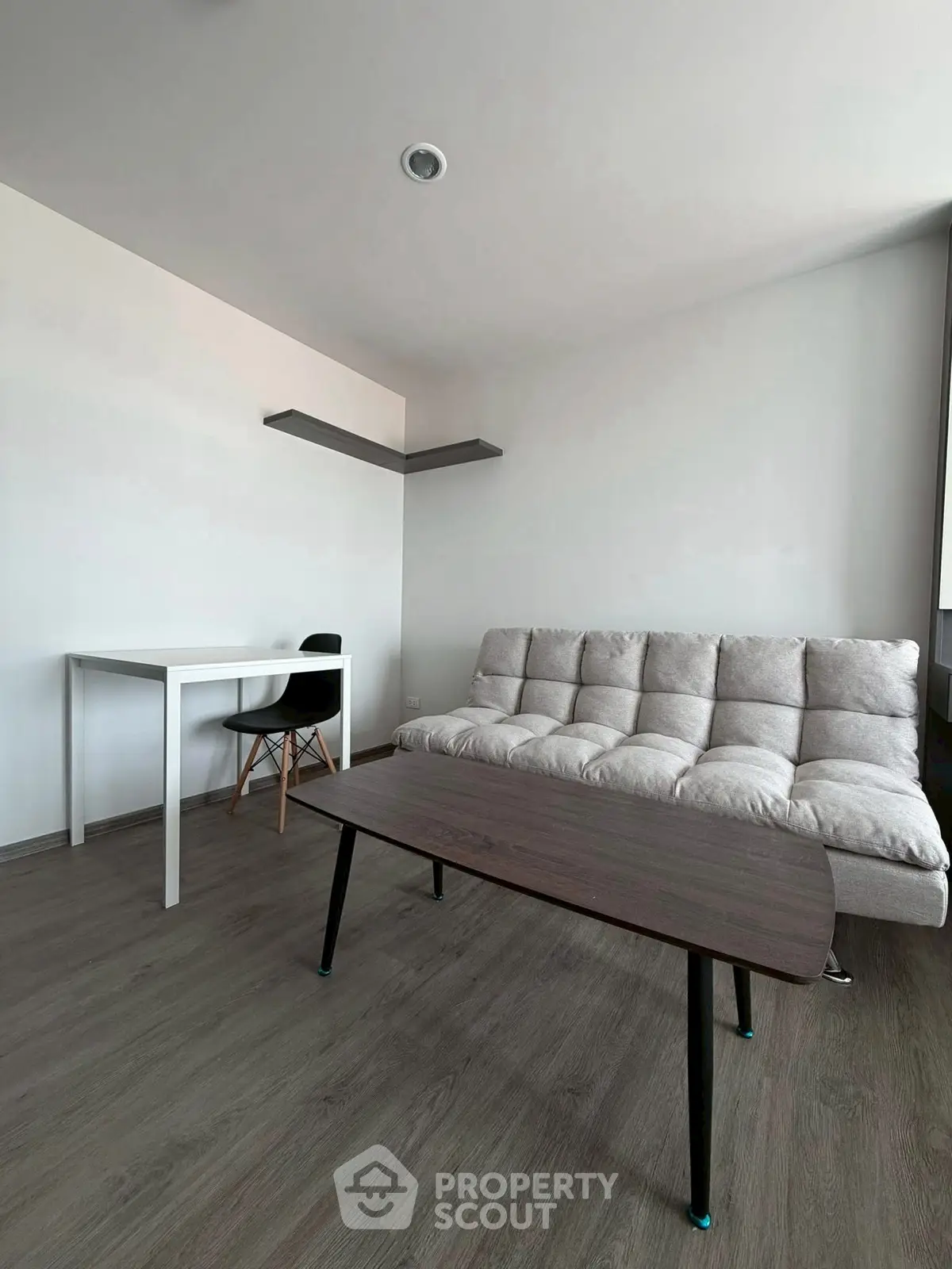 Modern minimalist living room with sleek furniture and neutral tones