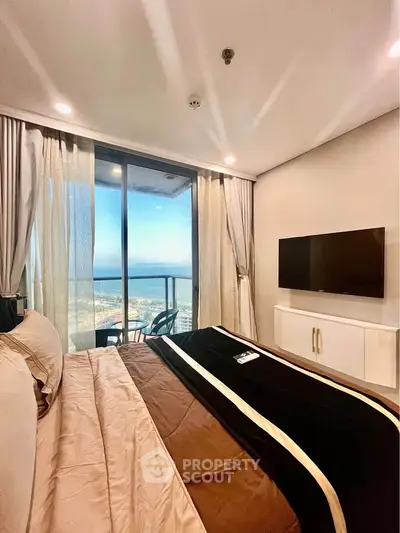 Luxurious bedroom with stunning ocean view and modern amenities