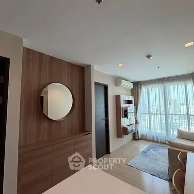 Modern living room with large windows and stylish decor