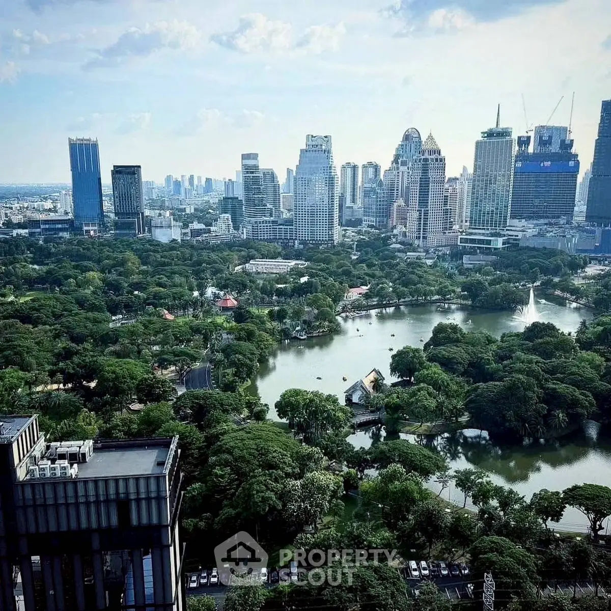 Stunning cityscape view with lush green park and skyline
