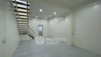 Spacious modern interior with sleek staircase and minimalist design