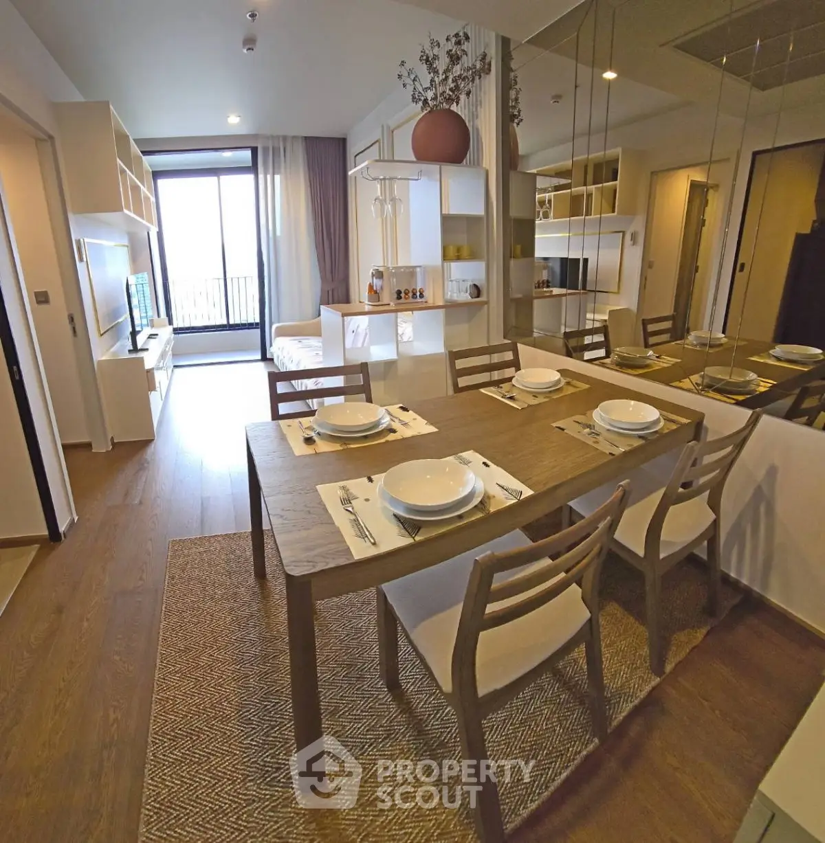 Modern open-plan living and dining area with stylish decor and natural light.